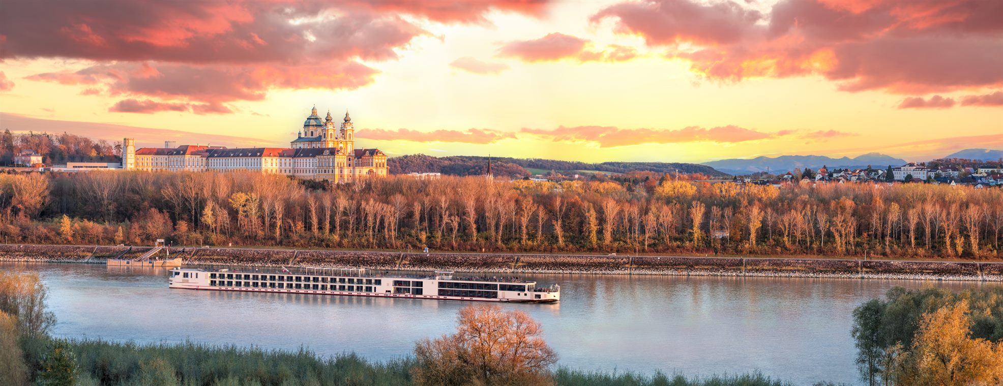 River cruise ship on the Danube at sunset — river cruise deals