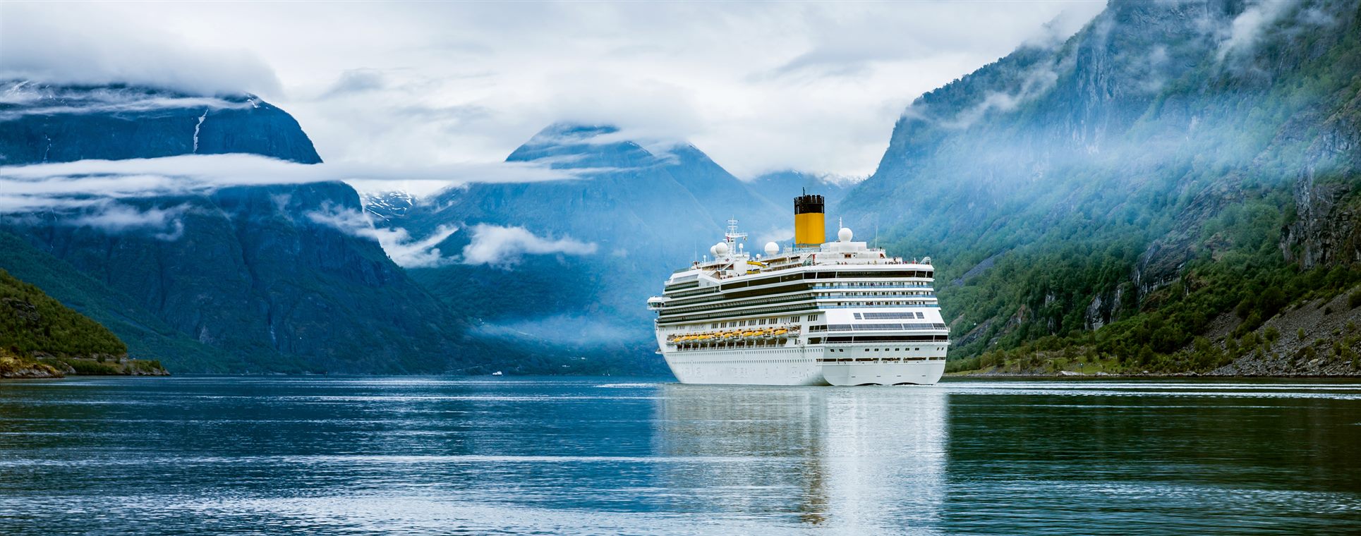 Cruise ship in a Norwegian fjord — expedition cruise deals